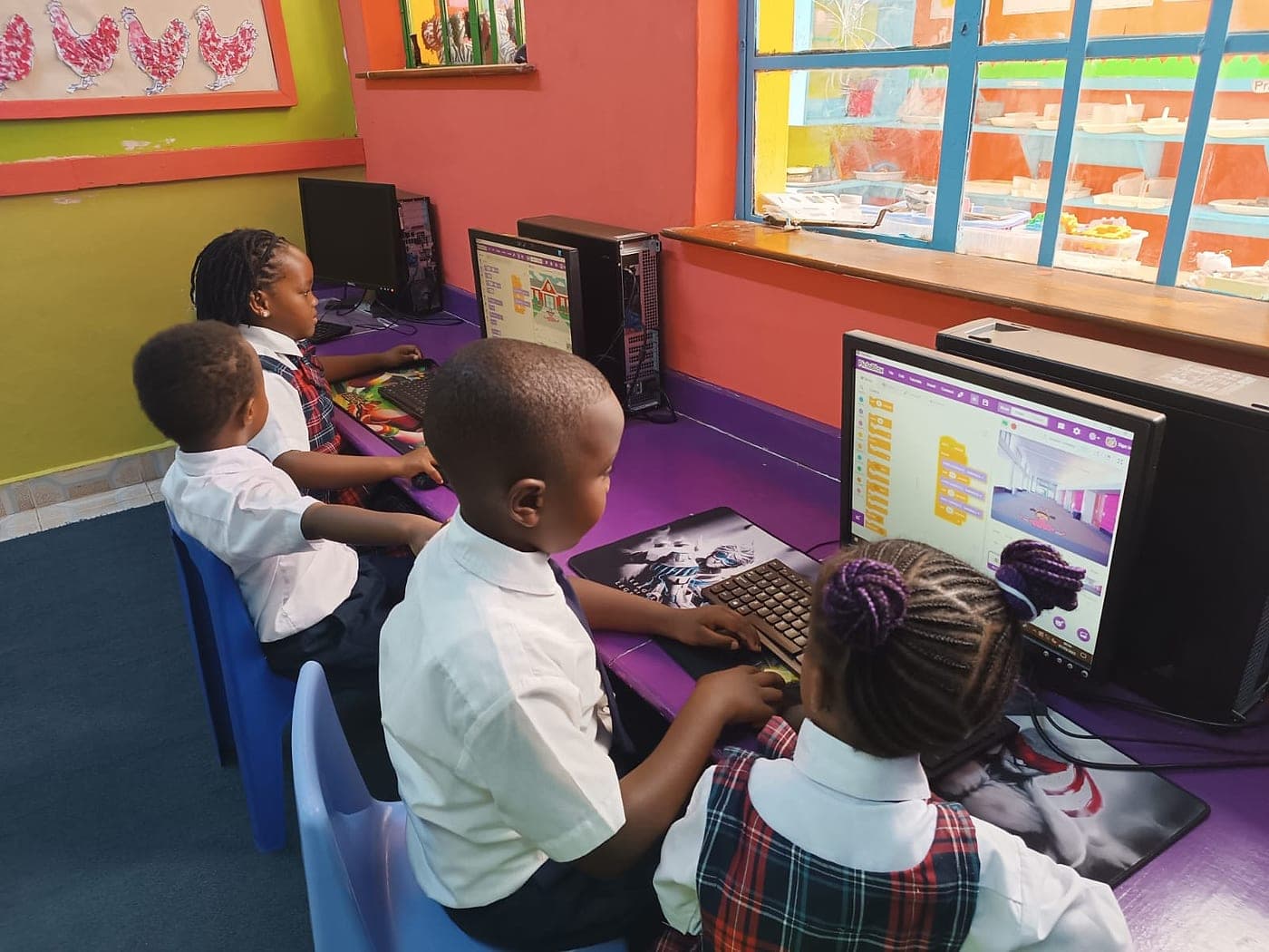 Learners building block-based code on classroom computers