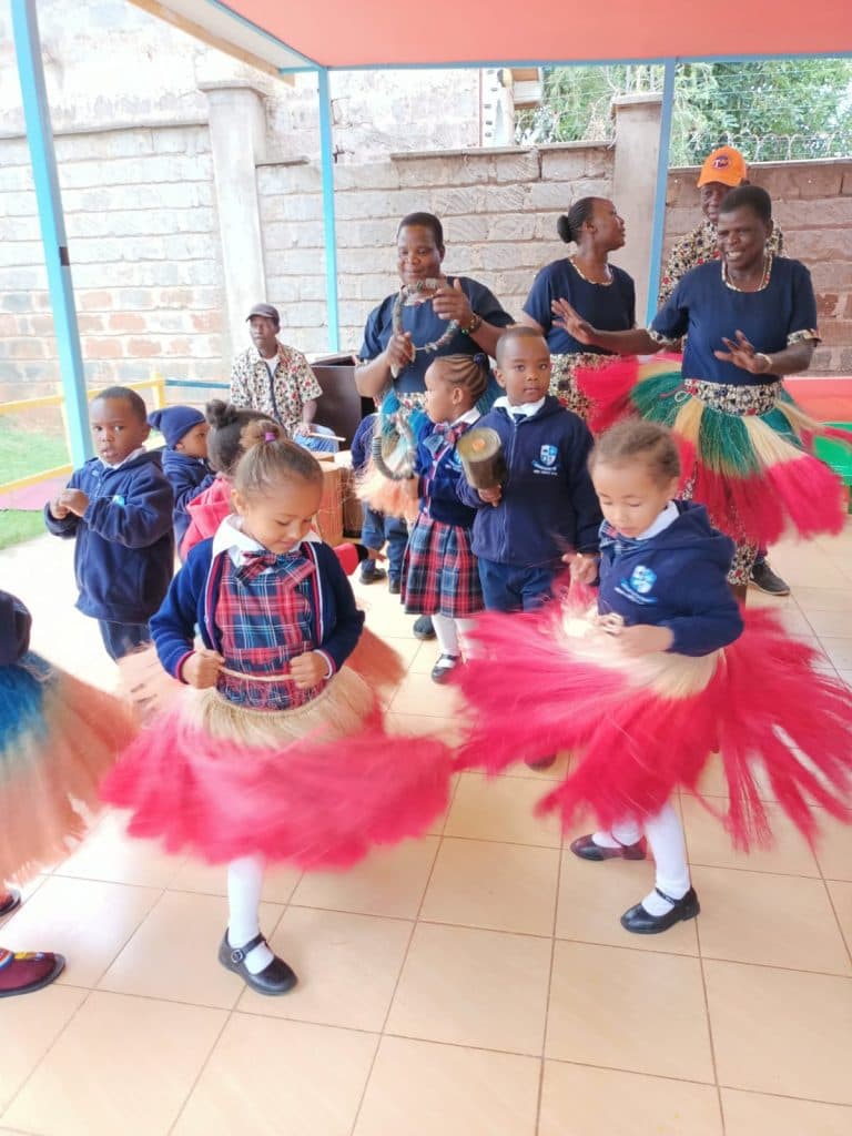 Children performing a cultural dance in costume